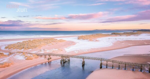 Photograph of a serene sunset over Lossiemouth, showcasing a breathtaking array of subtle and beautiful colors in the evening sky. This image is available as a print from the Moray Jewel's online shop at morayjewel.com.