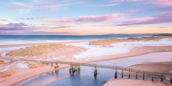 Photograph of a serene sunset over Lossiemouth, showcasing a breathtaking array of subtle and beautiful colors in the evening sky. This image is available as a print from the Moray Jewel's online shop at morayjewel.com.